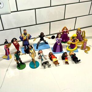 Assorted lot of Disney figurines, including Moana tangled Mulan Pocahontas